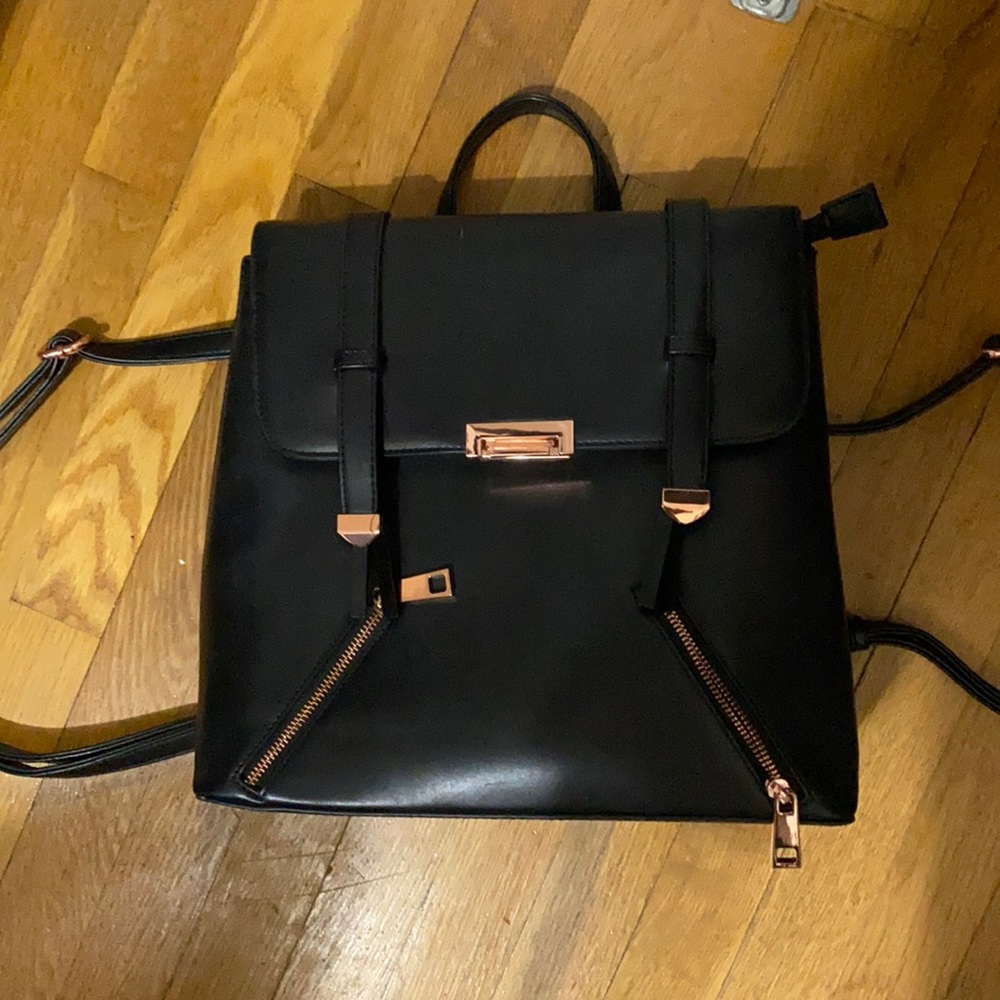 Black backpack with rose gold details